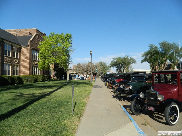 The tour members and their cars assembled for the tour of the building