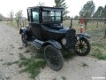 A nice rust-free 1924 Model T coupe on the side of the road