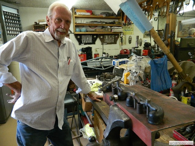 Dean preparing to straighten an exhaust manifold