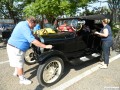 Russell arranging decorations on his 1926 Model T touring car