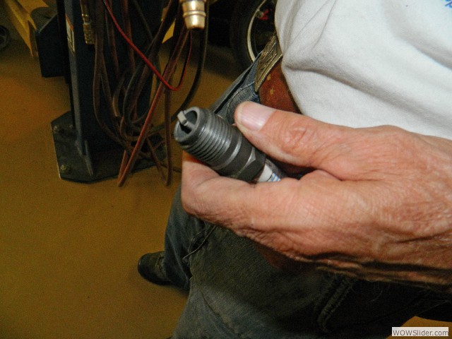 Paul cleaning a spark plug
