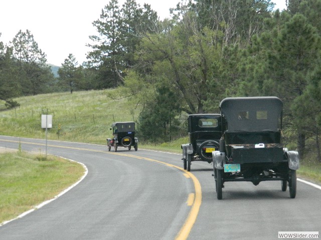 Neil and Mary Ann in their 1916 touring (front), Betty in her 1921 coupe (middle), and Michael in Pete the 1923 pickup