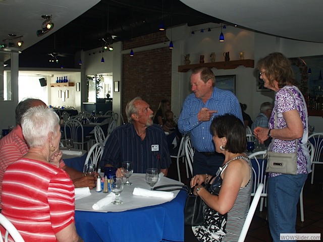 Bob and Liz talking with club president Dean