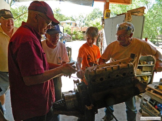 Kirk, Russell, Paul, Cole and Larry examining the 1926 engine 