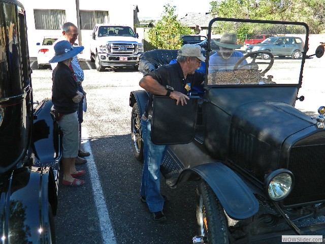 Larry assisting the Duncan's with their 1920 touring car