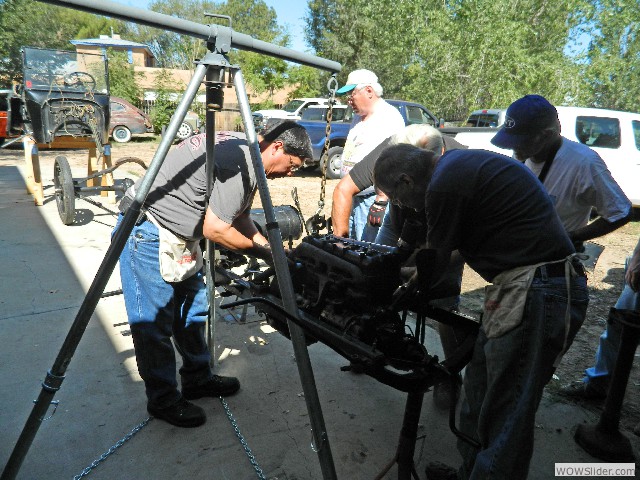 Mark, Dave, and Vern working on the engine