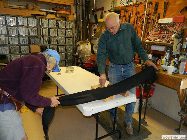 Skip work on his touring car top with Marilyn