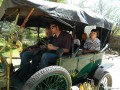 Larry teaching Gary Marsh to drive a Model T with Dylan, Spencer, and Melanie
