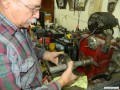 Larry demonstrating honing of the new bushings.