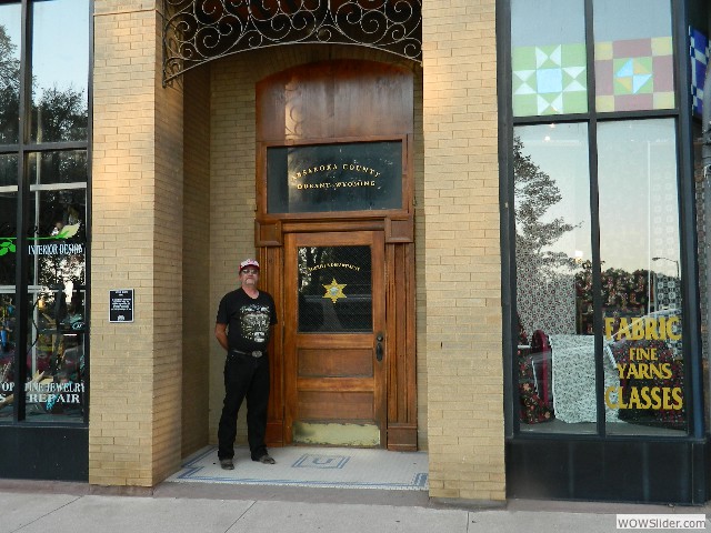 Vernon in front of the doorway used in a TV series that says Durant, Wyoming