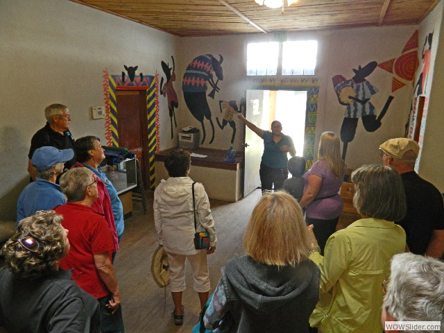 Our guide describing the history of the building and weaving center