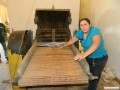 A machine to begin carding the wool prior to washing it