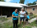 Susan presenting our guide with a donation to the weaving center