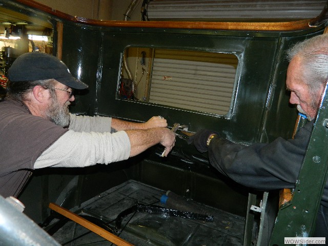 Vernon and Dean temporarily clamping the rear shelf in place.
