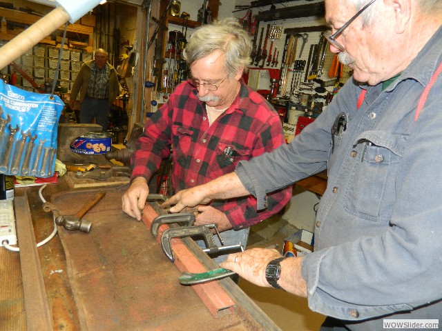 Larry and Bob using clamps to straighten the bent tailgate.