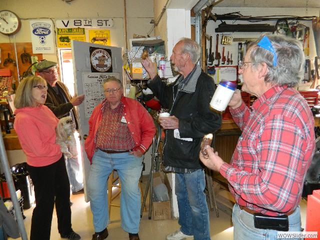 The work party members enjoying a chat and doughnuts before getting to work.