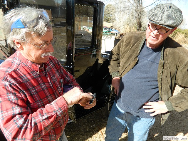 Larry and Steve discussing how to correct the door latching problem.