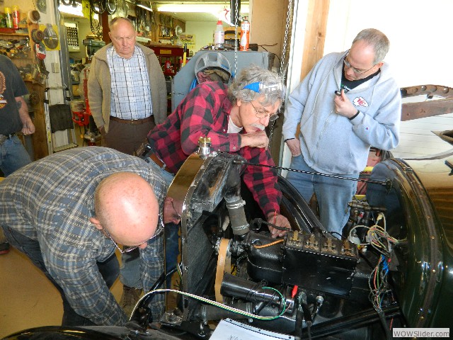 Larry checking for piston TDC with Kirk at the crank.