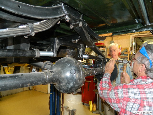 Larry disasembling the rear end of Bruce's coupe.