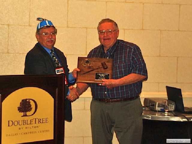 Tom Miles receiving a award for his service as MTFCA President