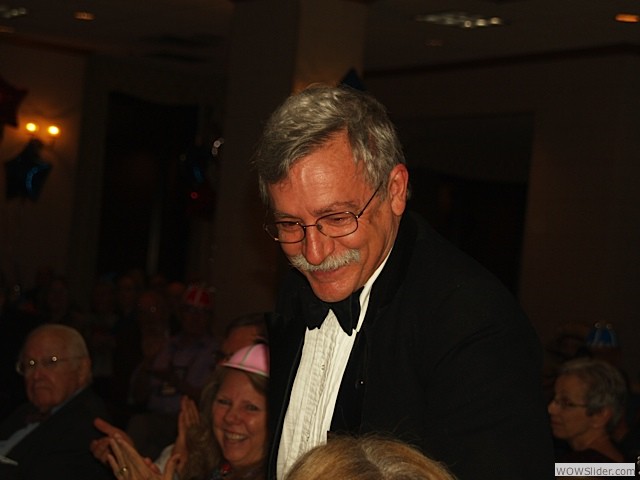 Larry receiving the news of his winning the Rosenthal Award