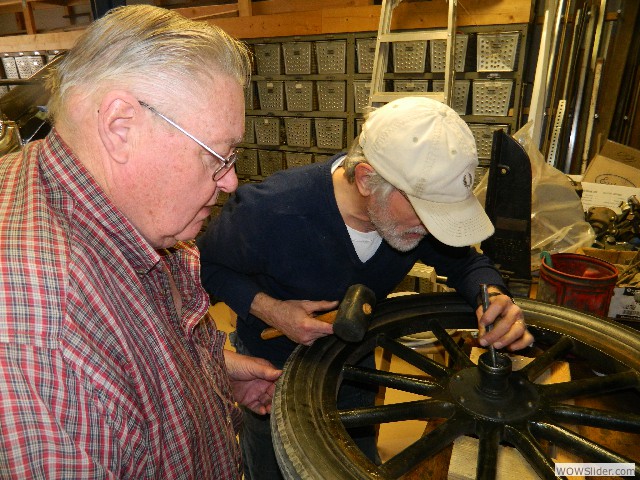 Tom and Paul working on Paul's 1920 tour car wheel