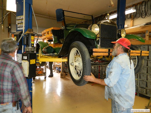 Vernon checking the front wheel on Bob's 1926 pickup truck.