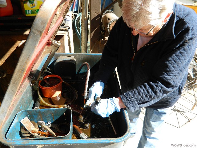 Betty cleaning steering parts.