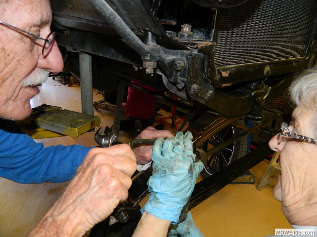 Don and Betty preparing the axle to receive the rebuilt spindles.