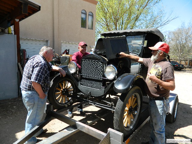 Tom, Kirk, and Vernon troubleshooting Tom's roadster.