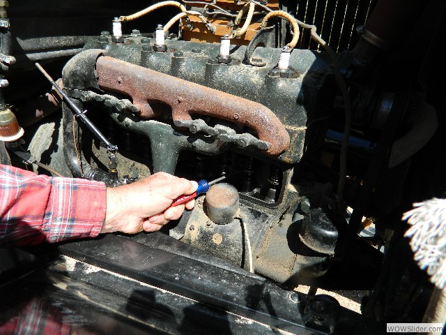 Larry trying to free a stuck valve.