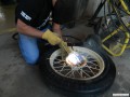 Welding bolts onto the spare tire bracket.