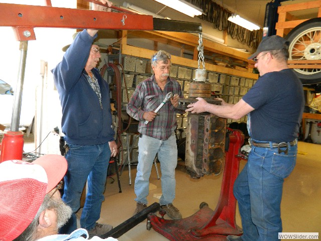 Neil, Larry, and Michael dissasembling Tom's 1926 engine