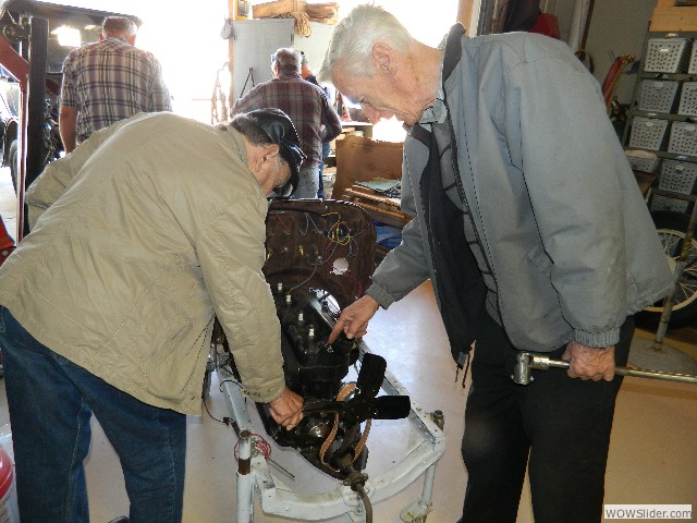 Dave's brother and John looking over Dave's engine on test stand.