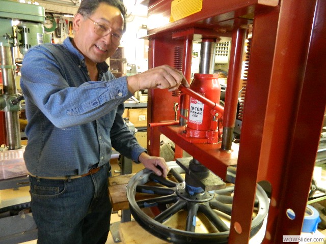 Mark pressing a hub for a front wheel