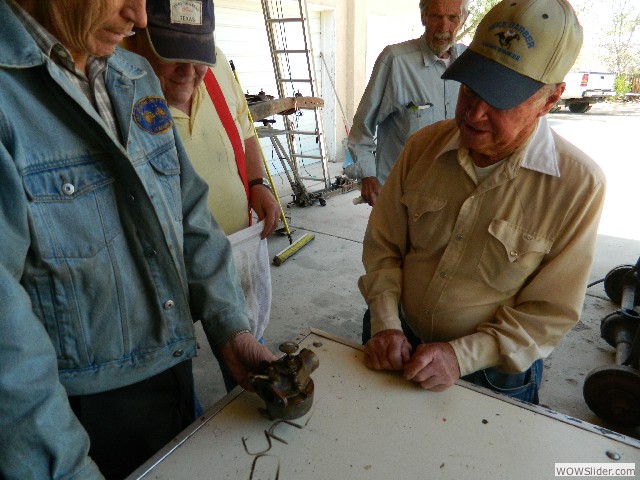 John and Herb Padgett examining his 1915 carburetor.  Russell and Dean are in the background.