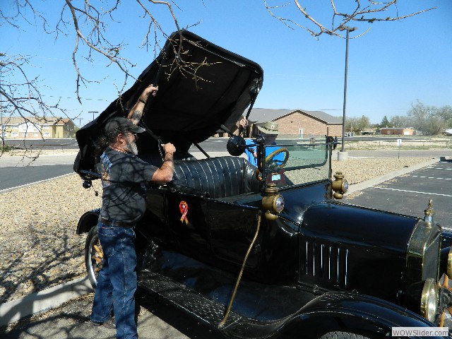 Vernon assisting Neil raise the top on his 1916 Model T touring car