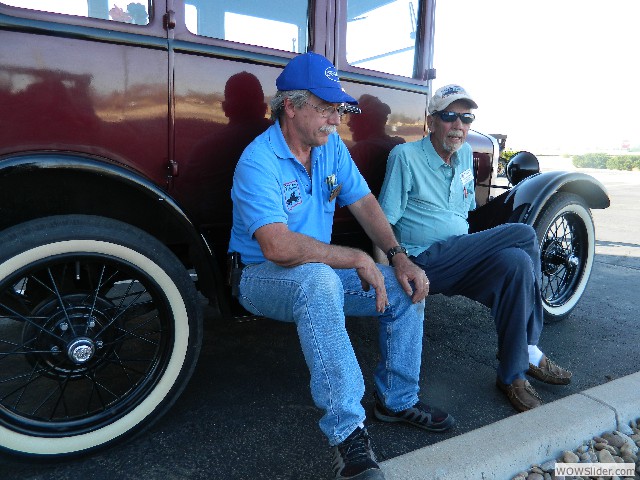 Larry and Dean resting on the running board of LuLu Belle, Linda's Fordor sedan