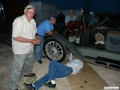 Les Haley with Larry and E.J. under the 1913 Buick